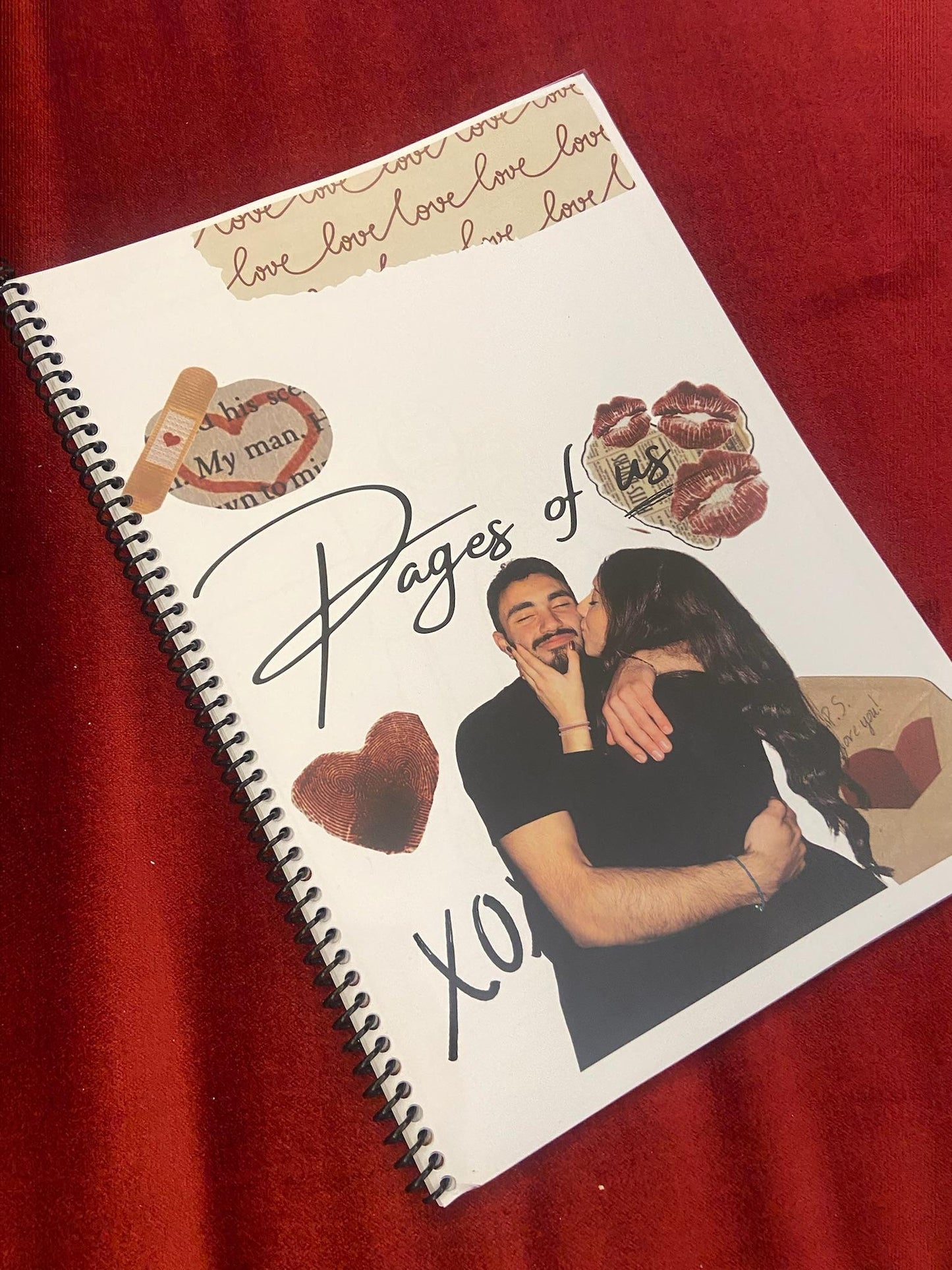 Notebook with a couple's photo and 'loves' text on a red background